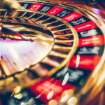 Spinning professional roulette wheel in casino. Property released.