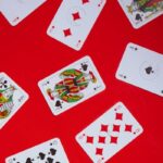 free-photo-of-photograph-of-playing-cards-on-a-red-surface